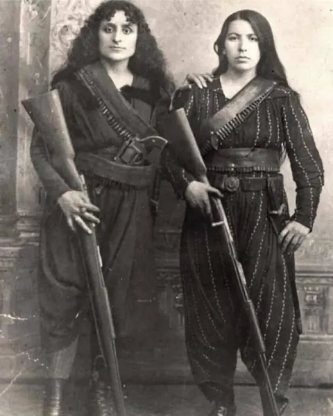 Two Armenian women posing with their rifles before going to war against the Ottomans. Photographed in 1895.