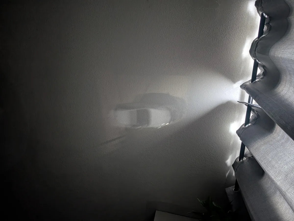 The light coming through my window this morning was acting as a projector for the driveway.