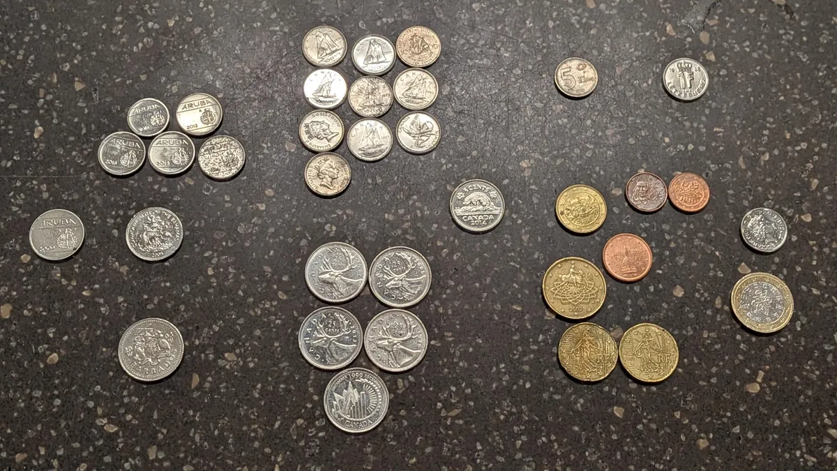 The Assortment of coins rejected by my store's coinstar machine