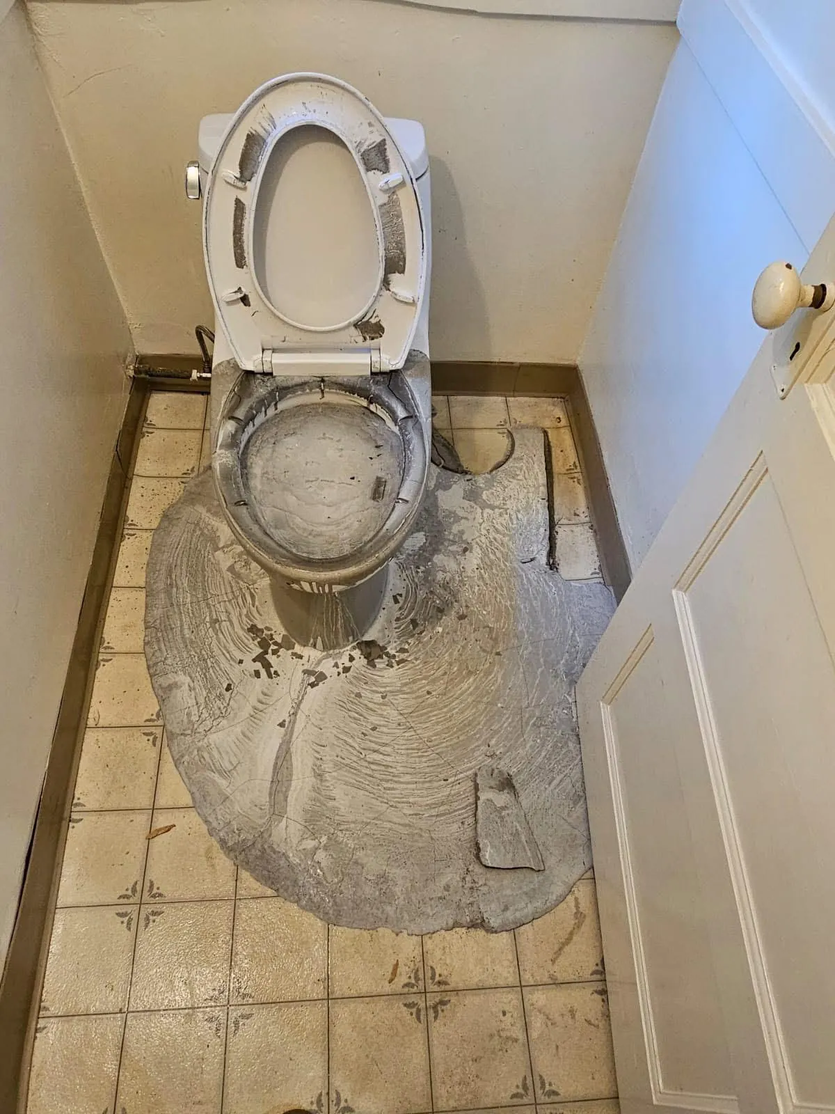 Concrete overflowed out of the toilet