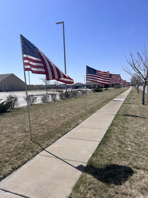 These flag poles are only about 8 feet tall, so every one of these flags has an opportunity to whap you in the face as you walk past