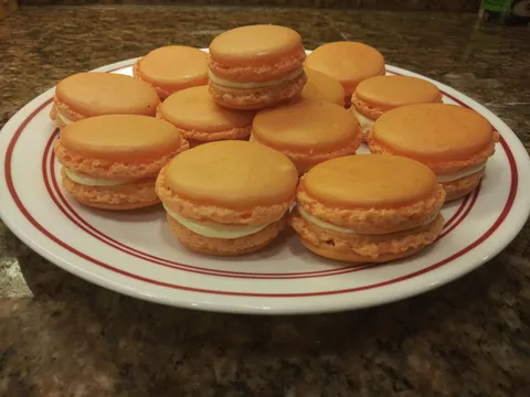 Made a perfect batch of orange creamsicle macarons. None of them cracked I'm so hyped.