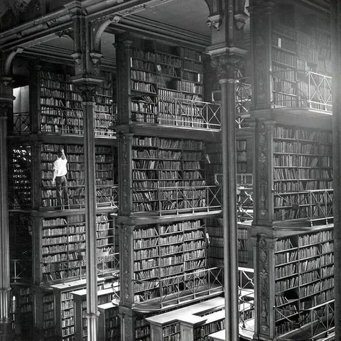 A man searches for books in the former Cincinnati Public Library. The building was demolished in 1955. Today there is an office building and parking lot where it used to stand.