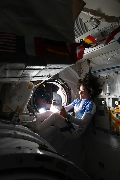 NASA Astronaut Christina H. Koch "says this is her favorite reading window, where she spends time relaxing by herself on weekends" aboard the International Space Station. Photo credit: National Aeronautics and Space Administration (NASA)
