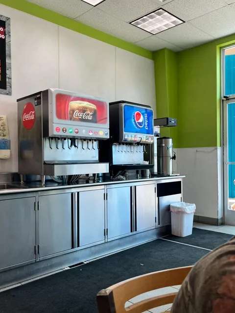 This restaurant in Hawaii has both Coke and Pepsi drinks.