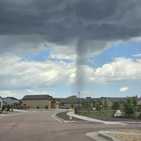 It looks like it's only raining over one house. 