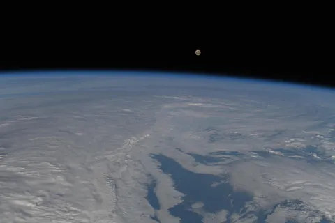 NASA astronaut Nichole Ayers took this image of the Moon and Earth from the ISS