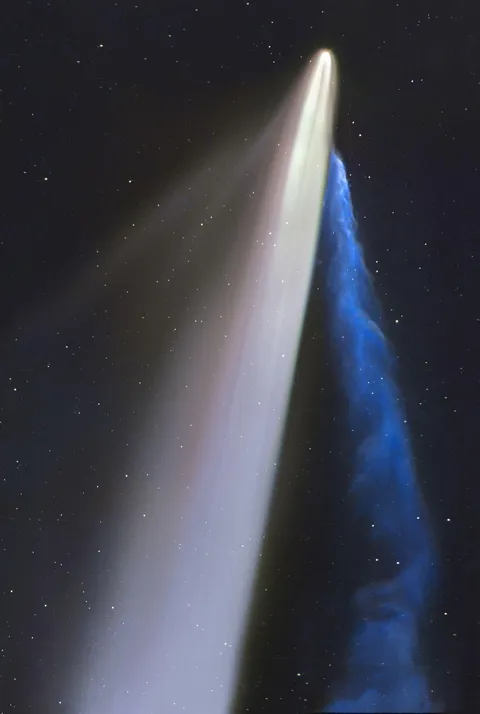 A close-up image of Comet Tsuchinshan-ATLAS featuring dust (grey) and ion (blue) tails.