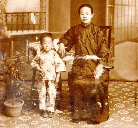 My grandmother and great grandmother late 1920s China. Since she was the only child, they kept her hair short like a boy so that she would be respected as the future head of the household. She also told me she refused to take this picture until they bribed her with grapes.
