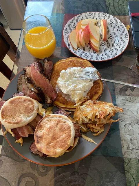 My wonderful husband made breakfast for me. Chocolate chip pancake with almond whipped cream, hash browns and peppered bacon, and egg sandwiches with peppered cooper and smoked gouda cheeses.