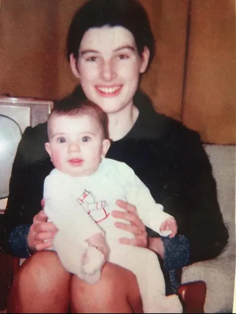 My beautiful mother, fully dressed, with chonky little me, early 1972.
