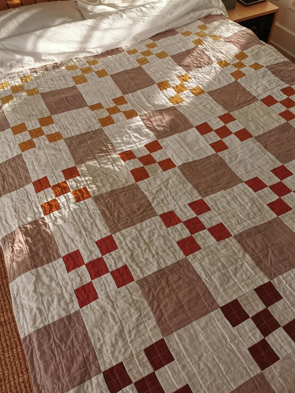 I taught myself to sew to make a cozy fall quilt for my bed. 90% thrifted fabric