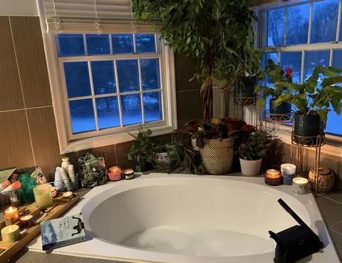 Book and a bath on a snowy night - looking out on the frozen pond