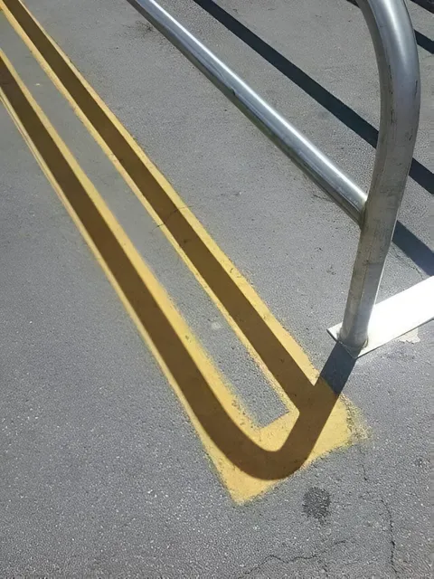These shadows from the railing. 