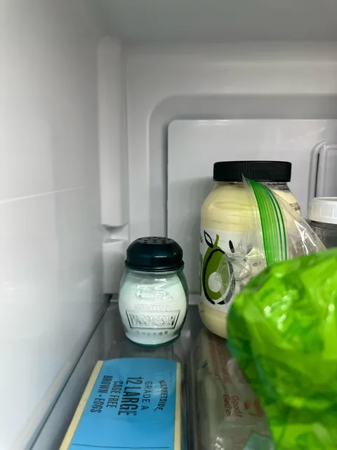 Thrift some vintage parm jars to use for baking soda for easy fridge deodorizing and by the sink to wash produce