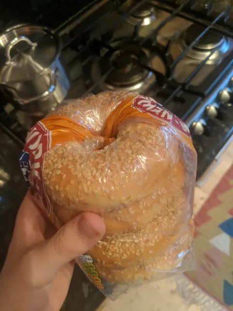 If you have a pack of bagels, use the hole in the bagel to stuff the open end of the packaging into to keep them fresh