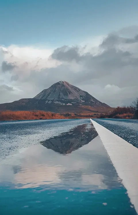 ITAP of a Mountain reflecting on a road.