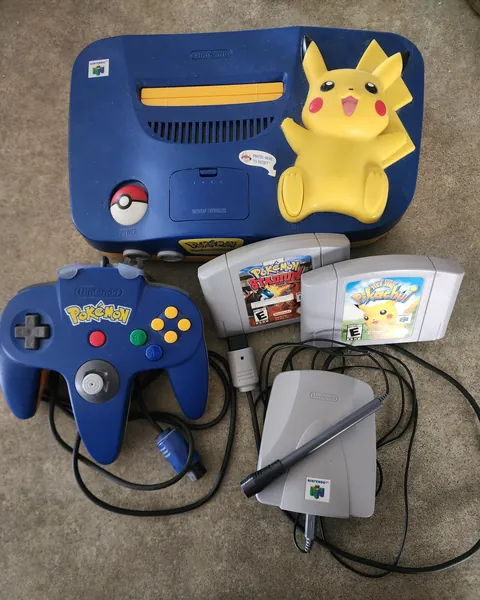 My Pikachu Edition Nintendo 64. The first console I ever owned. Games are: Pokémon Stadium and Hey You, Pikachu!