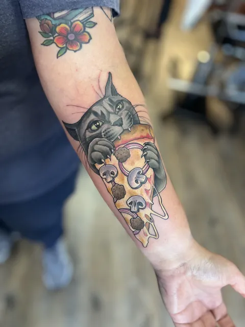 Cat eating pizza (Melissa Monroe at Trillium Tattoos in West Bend, WI)