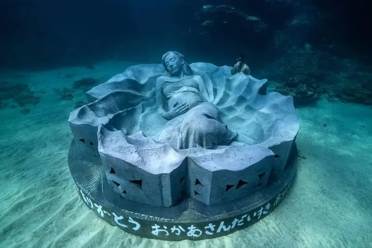 "Ocean Gaia", Japan's first underwater sculpture, weighing over 45 tons and 5.5 meters wide, created by British sculptor Jason deCaires Taylor, featuring Japanese model Kiko Mizuhara, resting 5 meters below the surface off the island of Tokunoshima, Japan, installed on October 14, 2025