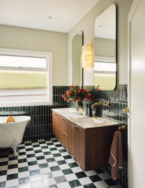Half-tiled bathroom with marble tile floors in a renovated Mornington house, Melbourne, Victoria, Australia [4000x5200]