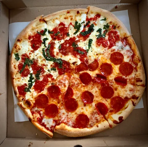 NYC pizza, freshly delivered in Queens.