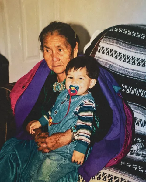My great grandmother in 1998 wearing her traditional Navajo clothing, with me sitting on her lap