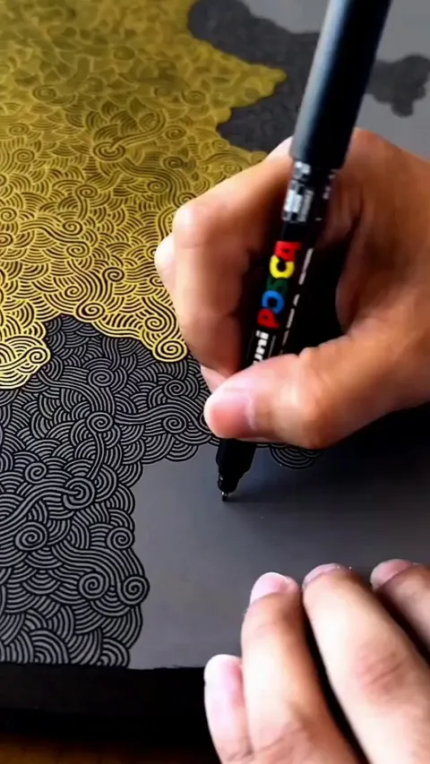 Creating these intricate patterns with a marker pen for an art piece