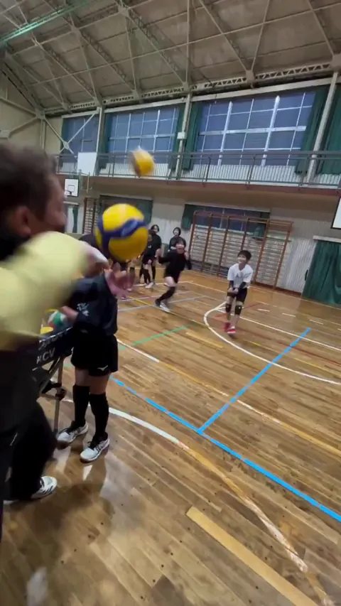 Japan’s Tominohara Volley team coach trains the kids to receive the ball