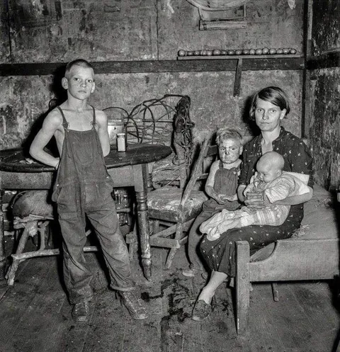Coal miner's wife and three of their children. Company house in Pursglove, Scotts Run, West Virginia, September 1938