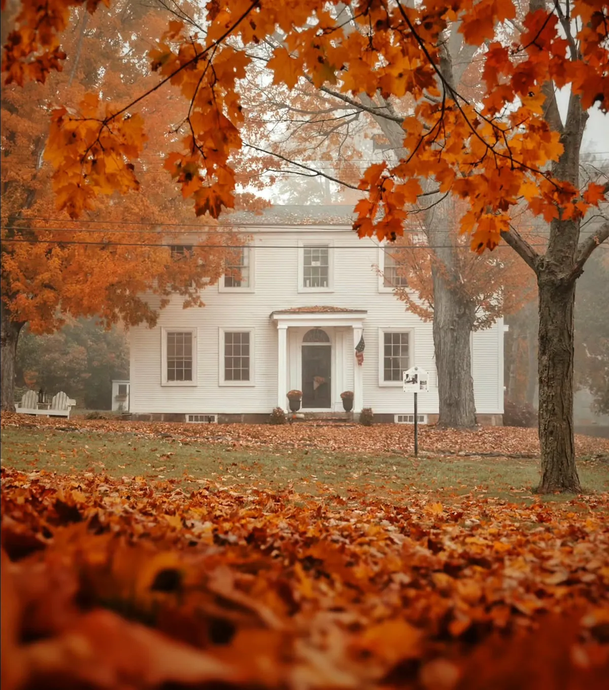 Colonial Revival house with fallen leaves in Wiscasset, Lincoln County, Maine.