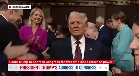 Rep. Melanie Stansbury held up a sign that said “this is not normal.” - Then, Rep. Lance Gooden proceeds to rip it out of her hands.