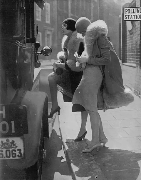 Two women, minutes after voting, London, 1929.