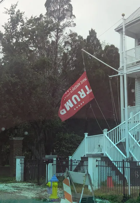 Saw this on the way to work. Trump flag hanging upside down, a symbol for distress [OC]