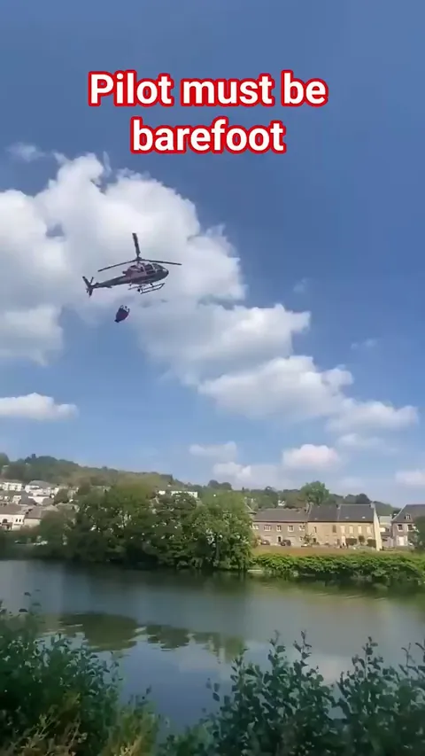 Firefighter Pilot skillfully fills up water from river