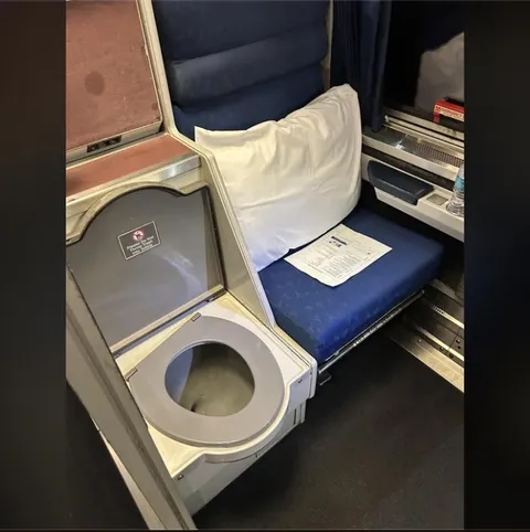 Behold the Amtrak "Roomette". Two facing travel seats and one for quality time. Cozy.