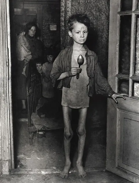 A 9-year-old boy from Amsterdam during the Dutch famine better known as "winter hunger" from 1944 to 45. Many children carried spoons with them wherever they went "just in case".