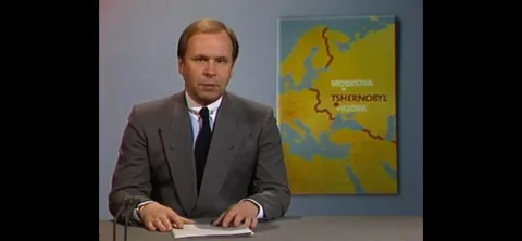 My grandma unintentionally captured the moment that the chernobyl disaster was talked about on finnish tv for the first time ever in the background of a family photo.