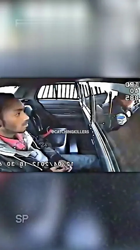 Suspect Pulls Gun on Officer From Backseat