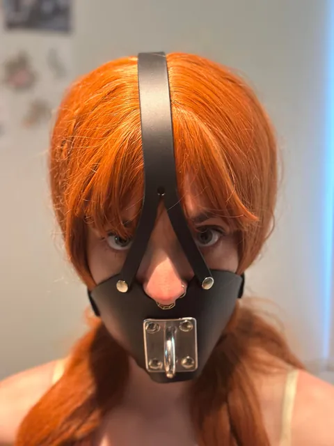 Muzzle gagged and chained