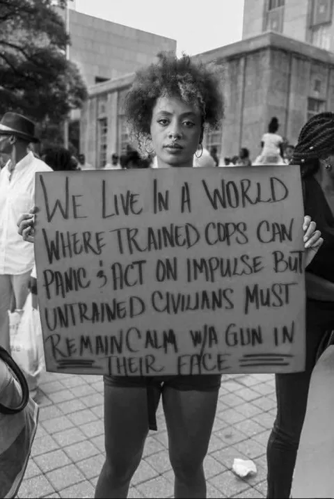 Woman protesting police brutality five years ago in Texas.
