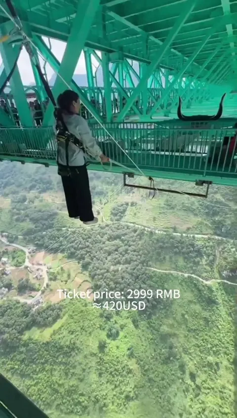 If you are brave, you can jump from the newly opened 625-meter-high (~2051 feet) Huajiang Canyon Bridge spanning over the Beipan River (China). However, a jump will cost you about 2999 RMB (~$420).