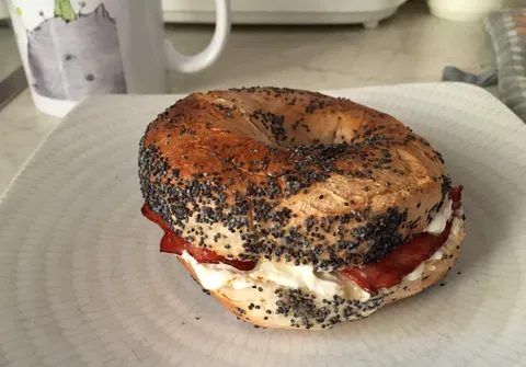 [I Ate] Montreal poppy seed bagel with cream cheese and smoked bacon