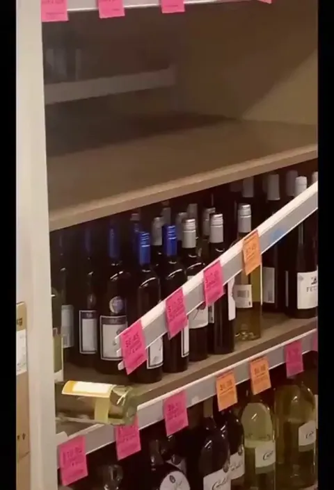 Worker dies inside when she can't stop dropping beer cases on the job