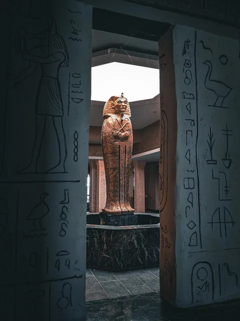 Sarcophagus statue inside abandoned Egyptian-themed restaurant