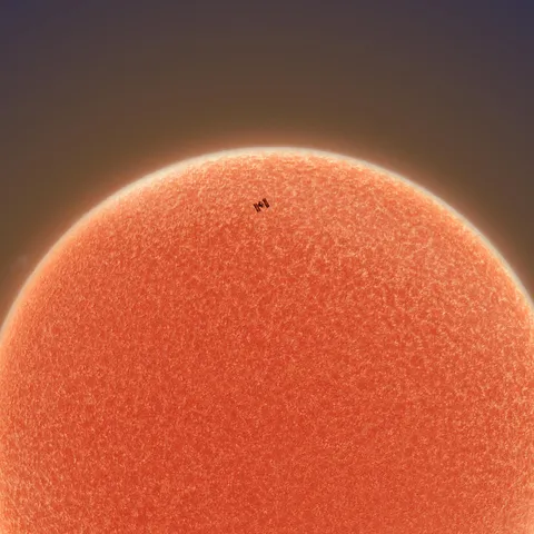 I captured a shot of the ISS as it crossed the face of the sun this afternoon. [OC]