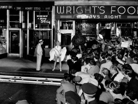 During filming of "The Seven Year Itch" in 1954, over 1,500 New Yorkers swarmed 51st Street to watch Marilyn Monroe's dress fly up. The crowd chanted "Higher! Higher!" as they gawked, enraging Monroe's husband Joe DiMaggio. He beat her so badly that night that she filed for divorce three weeks later
