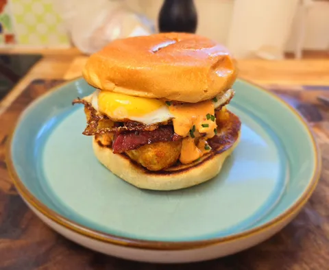 Breakfast sandwich - Smoked sausage, egg, hashbrowns, and a harissa and lime hollandaise 