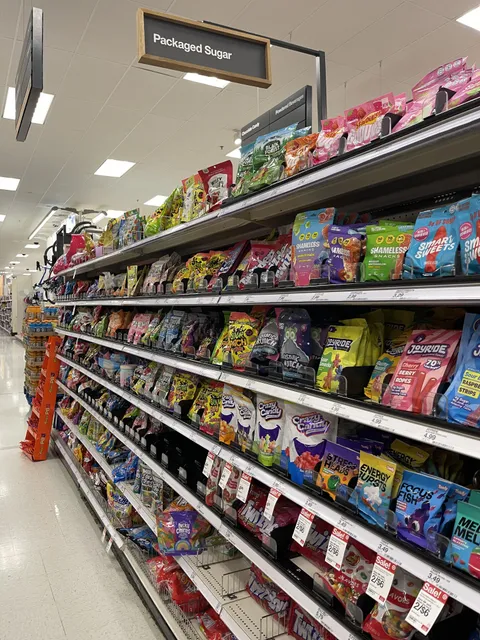 Candy aisle appropriately labeled as Packaged Sugar.