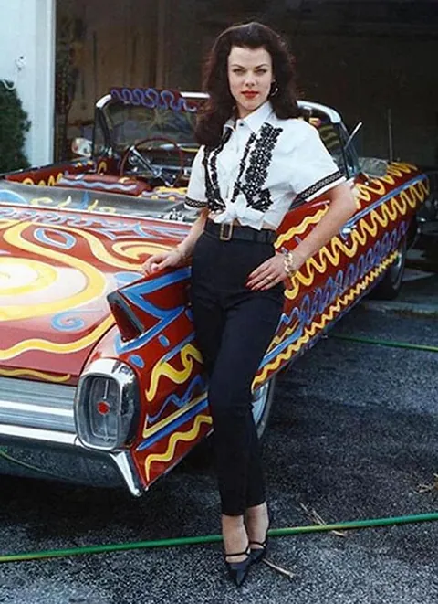 Debi Mazar with spray-painted, vintage Cadillac,  New York art and club scene, 1990s